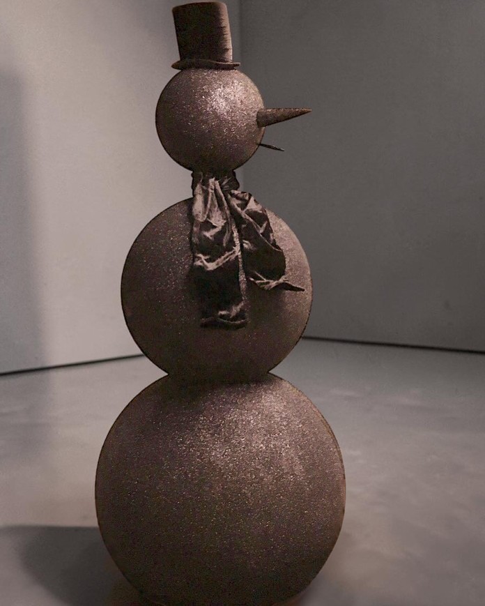 Custom sculpted snowman finished in black diamond dust with a top hat and silk scarf — bespoke installation for Rihanna